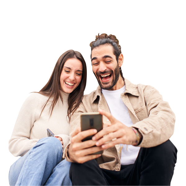 young couple laughing and watchin cellphone